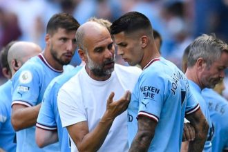 Pep Guardiola and Joao Cancelo