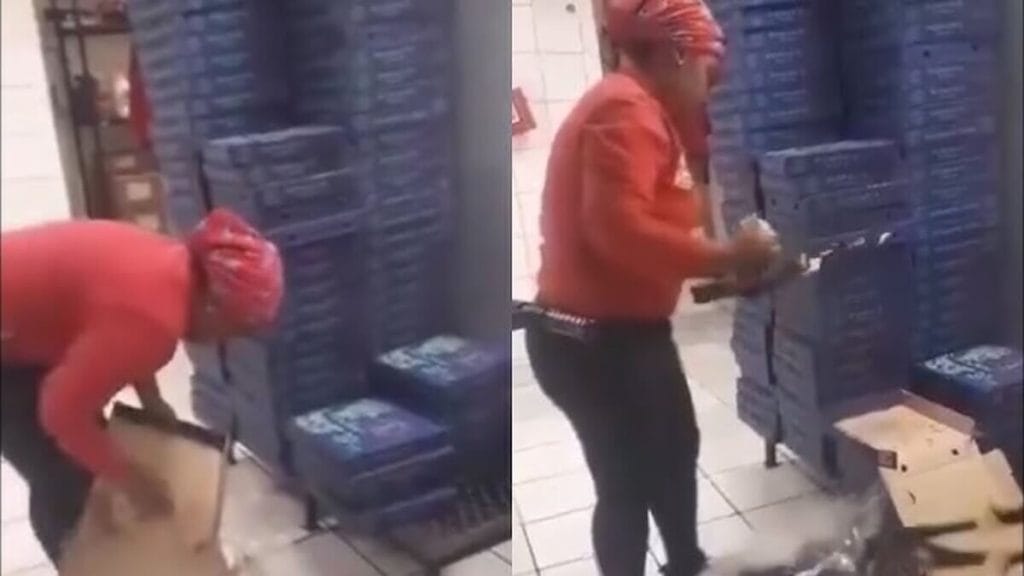 Woman in Roman's Pizza Uniform Cleans and Reuses Pizza Boxes