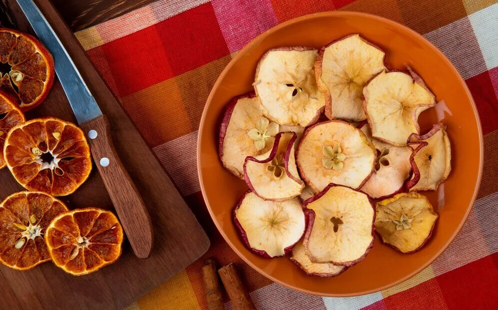 Top 15 Air Fryer Recipes You Should Try 57 top view dried orange slices with kitchen knife wooden cutting board dried apple slices plate plaid tablecloth 141793 7661 1