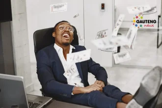 Man in office looking at Money flying