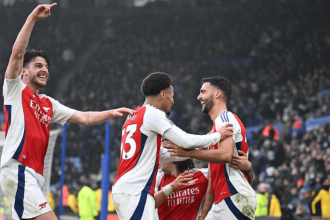 Mikel Merino celebrates scoring for Arsenal in a Premier League match against Leicester