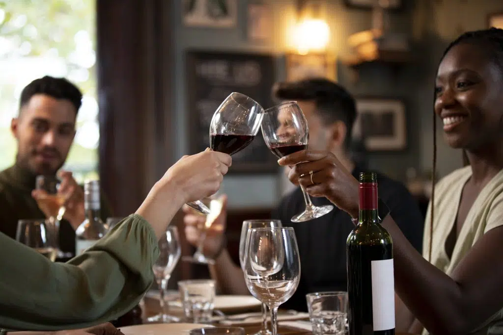 close up friends clinking glasses